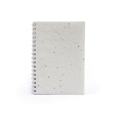 Carnet A6 en papier blanc moucheté avec spirale métallique gauche, sans marquage.