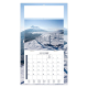 Calendrier publicitaire illustré d’un paysage côtier avec falaises, mer et îlot rocheux.