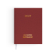 Agenda semainier fermé avec couverture rouge effet naturel et signet textile blanc.