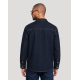 Surchemise unisexe publicitaire en denim Made in France vue de dos portée par un homme, zone de broderie au dos visible.