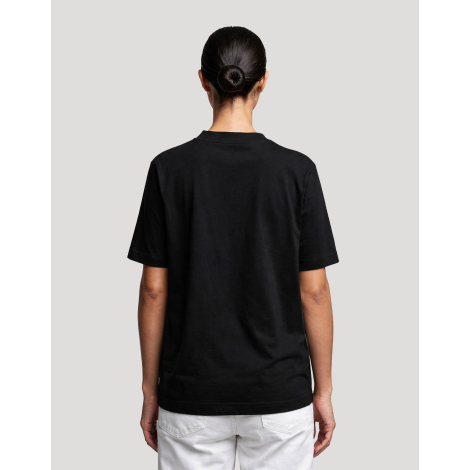T-shirt femme Hersch noir vu de dos avec pantalon blanc et dos uni, aucune personnalisation apparente