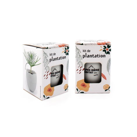 Deux kits de plantation dans leur boîte illustrée avec fenêtre laissant apparaître le petit pot blanc personnalisé, présentés de